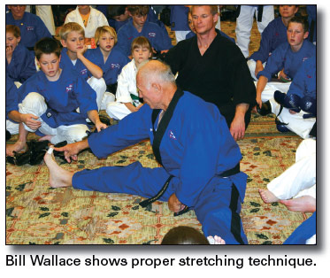 Bill Wallace shows proper stretching technique.